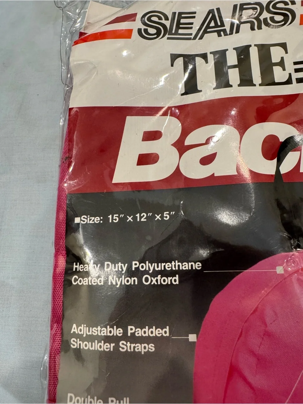Vintage 1980s Sears “The Bag” backpack in bright pink, Model #98063.